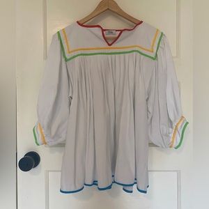 Beautiful white cotton blouse with color trim. Size free. New without tags.